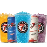 Seven Brew energy drinks and slushies lineup with orange and purple slush cups and energy drink cans