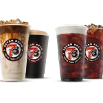 Four Seven Brew Classics drinks — caramel iced coffee, black hot cup, and two iced colas