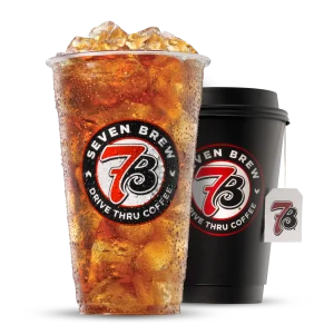 Seven Brew iced tea in clear cup next to hot coffee in black to-go cup